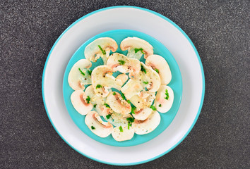 Vegetarian food: mushroom carpaccio with parmesan.