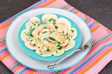 Vegetarian food: mushroom carpaccio with parmesan.