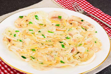 Vegetarian food: mushroom carpaccio with parmesan.
