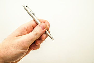 Hand mit Kugelschreiber, Vertragsabschluss