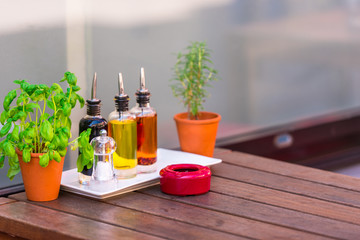 Cafe table with herbs and condiments