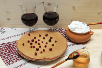 Maslenitsa with pancakes and red wine.