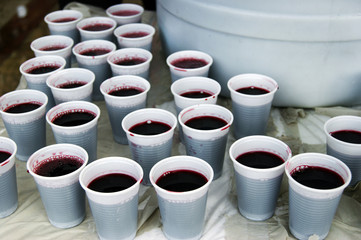 Red wine spilled on plastic beakers