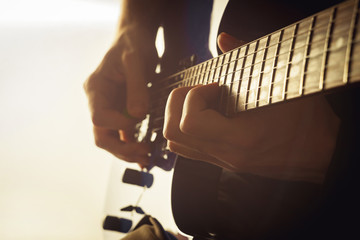 Men playing guitar close-up shot