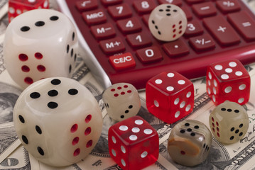 Money, calculator and dice