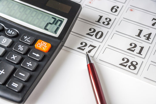 Calculator,Pen And Calendar on white background