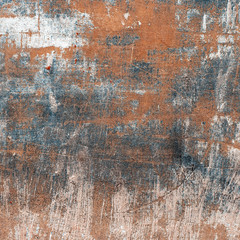 Blue and orange wall with cracks