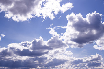 Fototapeta premium Fluffy white clouds and clear blue sky 