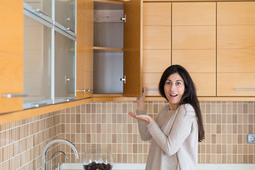 Young beautiful woman in the kitchen