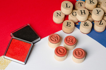 Text WORD on wooden stamps.