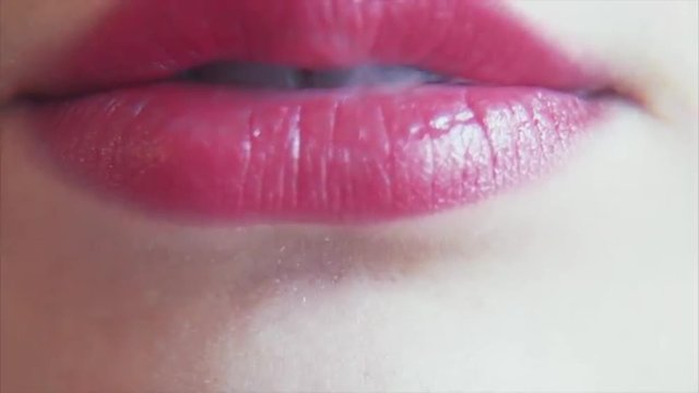 Female Lips Exhale Smoke From a Hookah