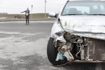 broken car after the accident in  foreground