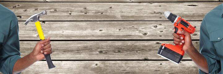 Worker man with hammer and drill.