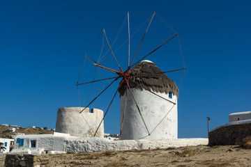 Fototapeta na wymiar Amazing view of White windmills on the island of Mykonos, Cyclades, Greece
