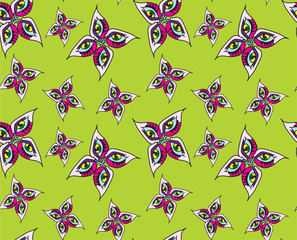 abstract butterfly monsters on a green background seamless vector pattern