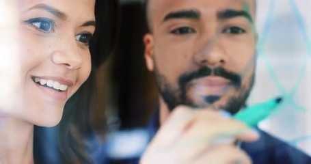 Business woman drawing graph on glass showing vision in Creative business team meeting brainstorming ideas working together sharing data  in modern glass office - Powered by Adobe