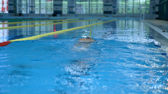 Underwater swimming in indoor swimming pool
