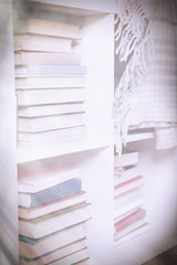 Stacks of books on a shelf, close up