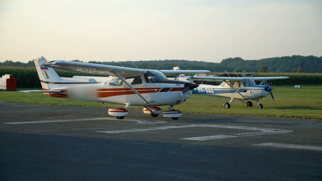 The engine on a plane has started and the plan starts moving