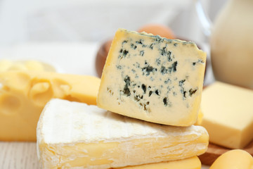 Set of fresh dairy products on white wooden table