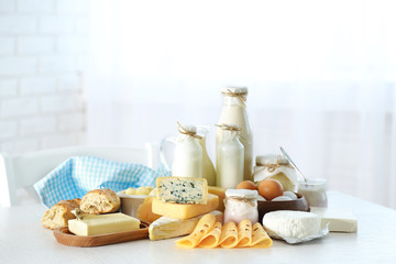 Set of fresh dairy products on white wooden table