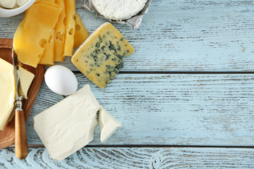 Frame of fresh dairy products on blue wooden table