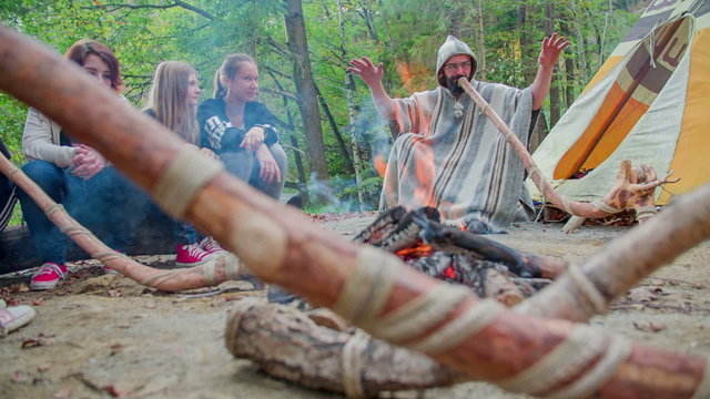 Camp fire in front of the big tent 