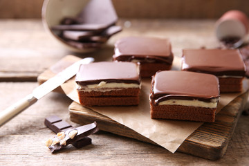 Delicious chocolate brownies on wooden background
