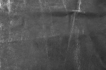 Silver cloth texture with uneven crumpled surface