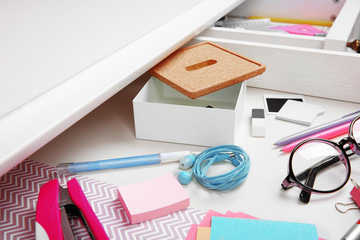 Stationery in open desk drawer closeup