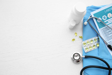 Stethoscope and medical equipment on a light blue background