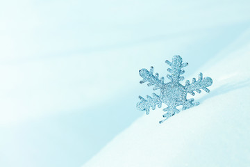 Fototapeta na wymiar Beautiful snowflake on natural snowdrift, close up