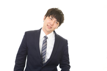 困惑した表情のビジネスマン