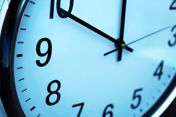 Clock face in blue light closeup