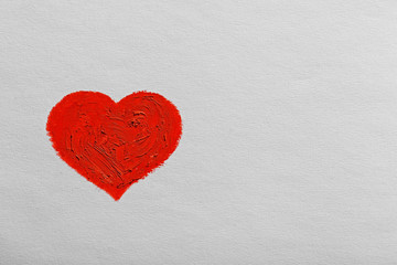 Red heart painted on light background
