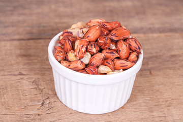 Tiger peanut in bowl on wood table