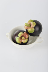 asian tropical mangosteen fruit on white background
