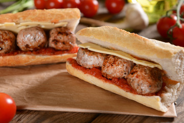 Sandwich with meat balls, cheese and sauce