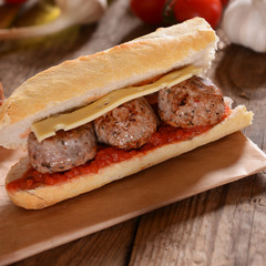 Sandwich with meat balls, cheese and sauce