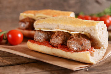 Sandwich with meat balls, cheese and sauce