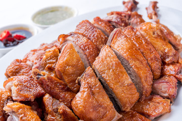 Roast duck, Chinese style on the white dish and white tablecloth