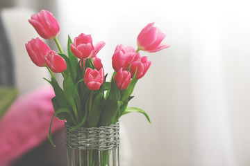 Bouquet of pink tulips in a vase, close up