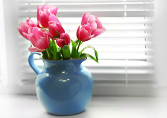 Bouquet of pink tulips in a vase, close up