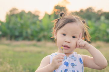 Little Asian girl playing outdoor
