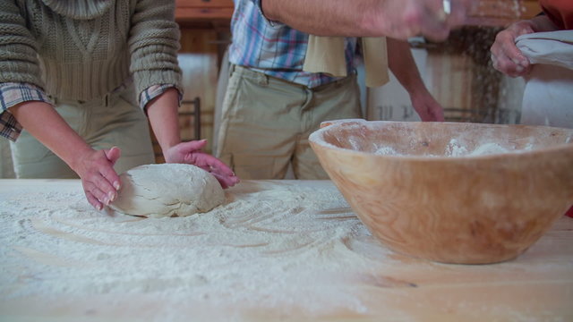 Couple gives the bough in the wooden bool to go in to rising process 