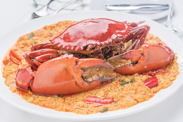 Stir-fried crab curry on white dish, famous food of Asian