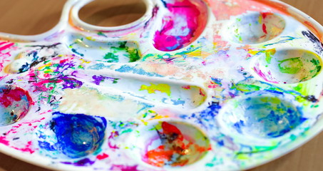 Obraz na płótnie Canvas Art Palette with colored paints.