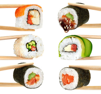 Sushi rolls isolated on white background. Chopsticks.