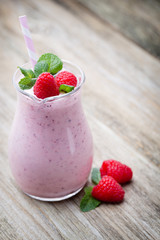 Raspberry milk shake with mint decor.