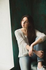 Fototapeta premium Portrait of young lady in photostudio interior